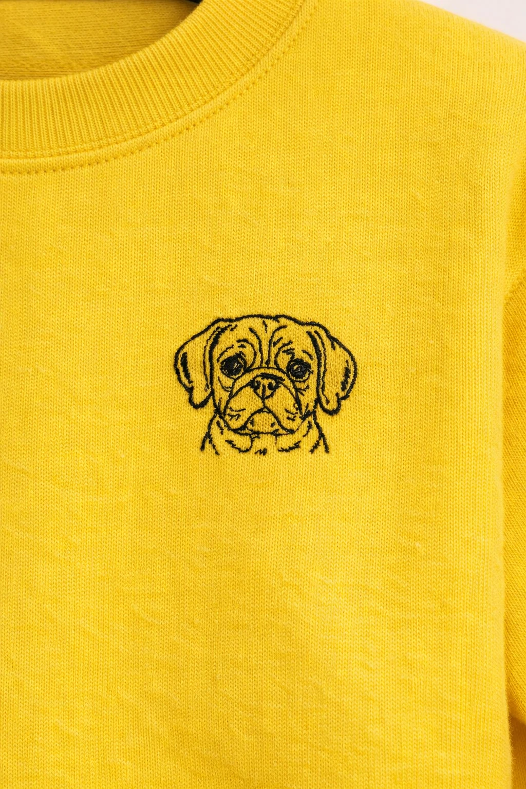 Lucky Threads Puggle design on yellow sweatshirt