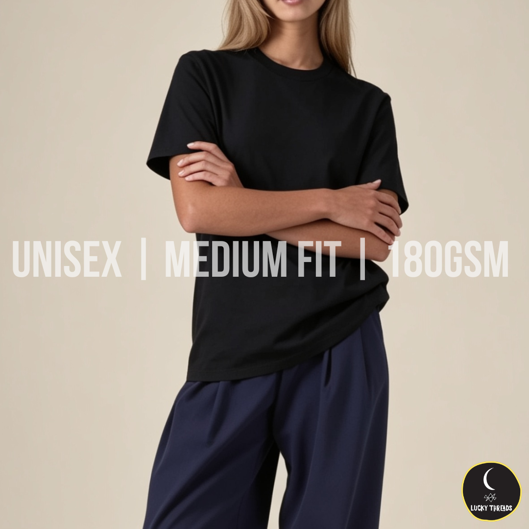 Black unisex medium‑fit 180GSM T‑shirt worn by a model against a beige background.