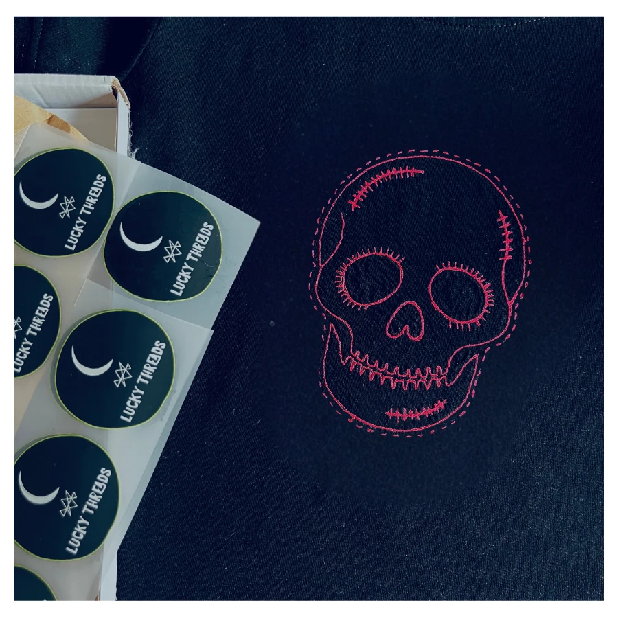 Black tee with pink skull by lucky threads Uk