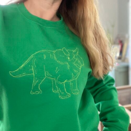 lucky threads dino on green sweater