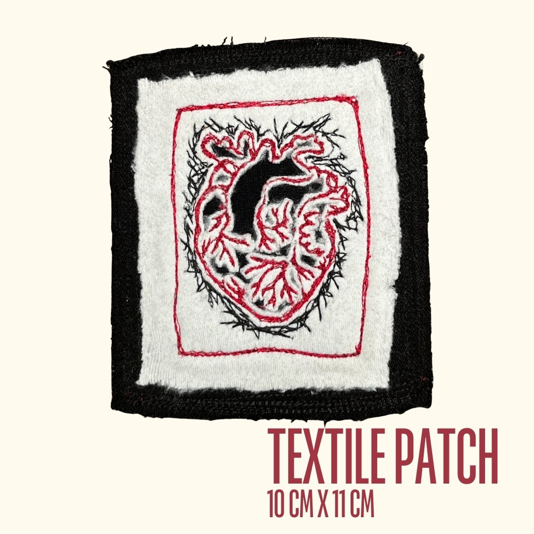 Handmade anatomical heart textile patch in red, black and white free-motion embroidery